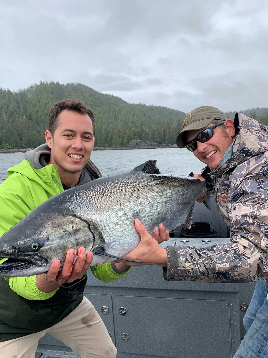 Lodge owner Scott Van Valin with a guest and a king salmon
