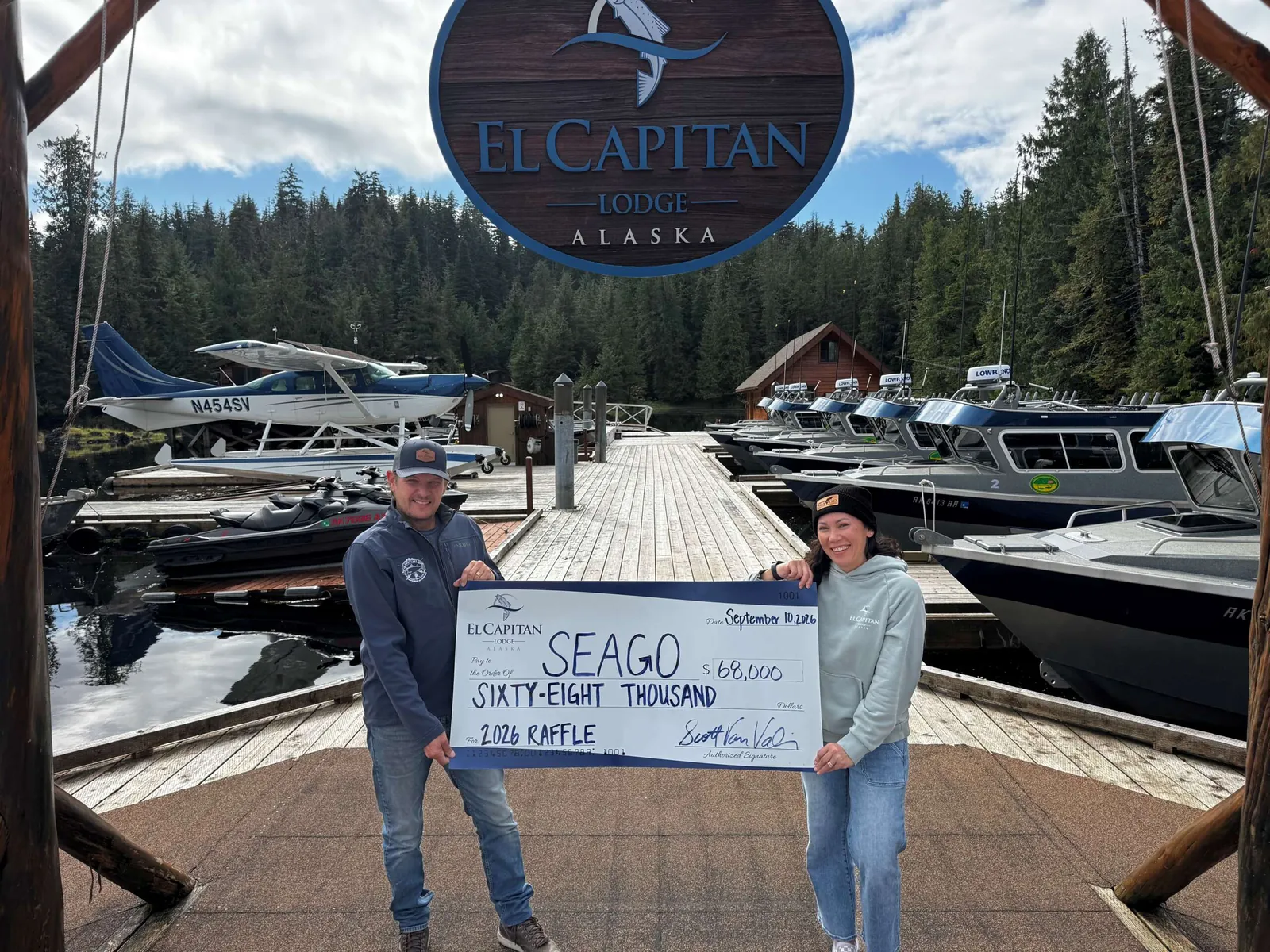 The 2026 SEAGO raffle cheque for $68,000 presented on the lodge dock